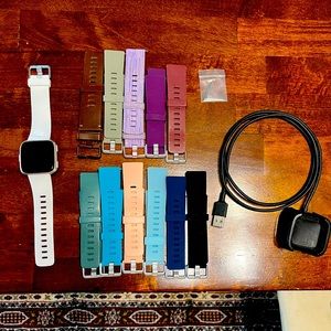 FitBit Versa Gen 1 (FB505) with charger and 12 wristbands